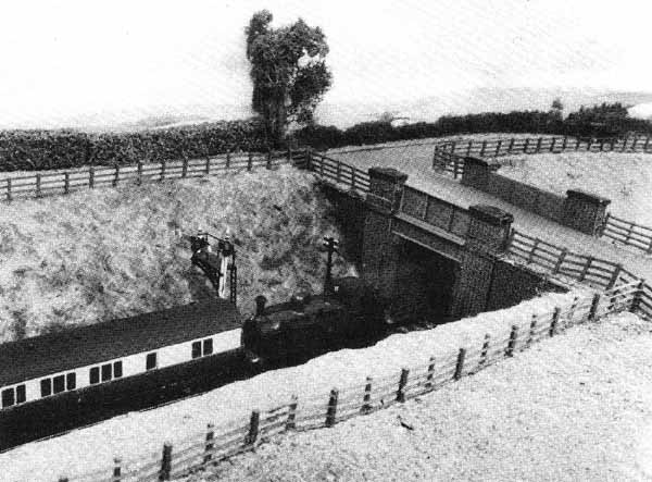 Burford - Metro tank and 'B' set approach through cutting and road overbridge